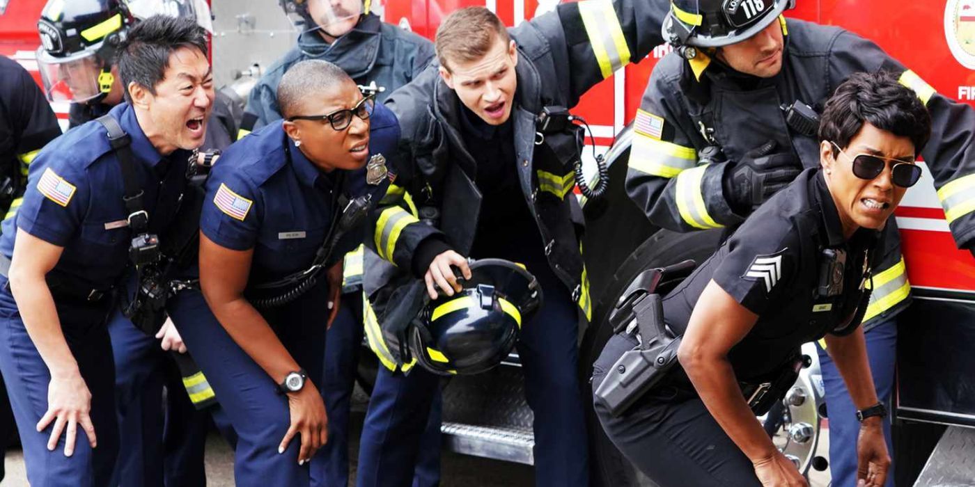 The cast of 9-1-1 gathered next to a fire truck