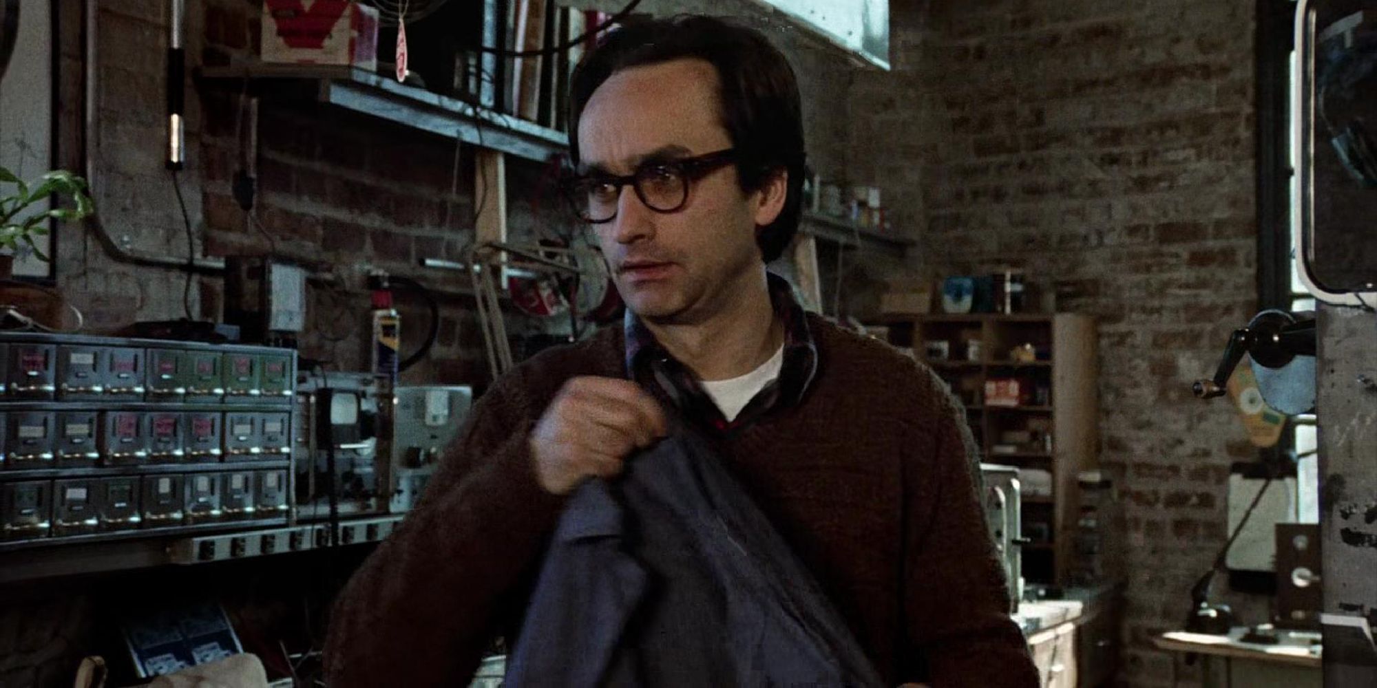 John Cazale as Stan looking concerned as he puts on his jacket in Francis Ford Coppola&rsquo;s The Conversation