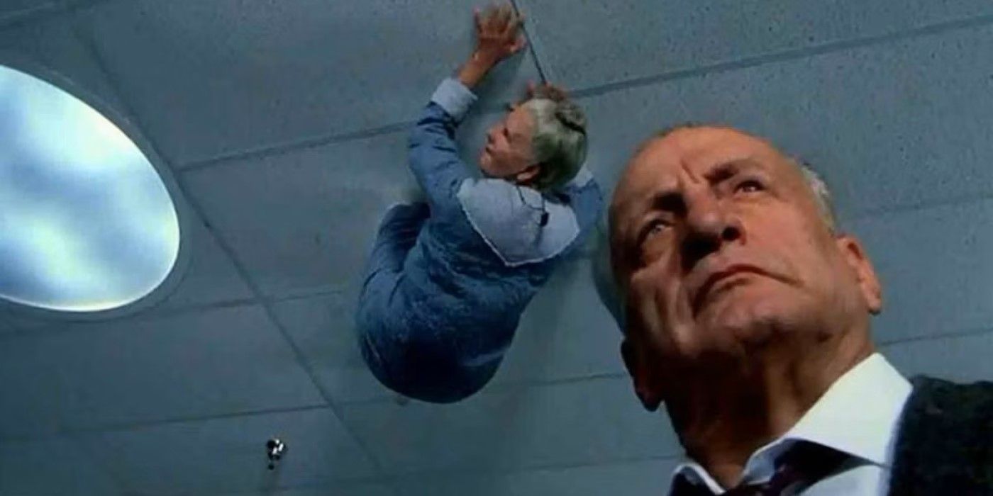 A demon crawls on the ceiling above Lt. Kinderman (George C. Scott) in 'Exorcist III'
