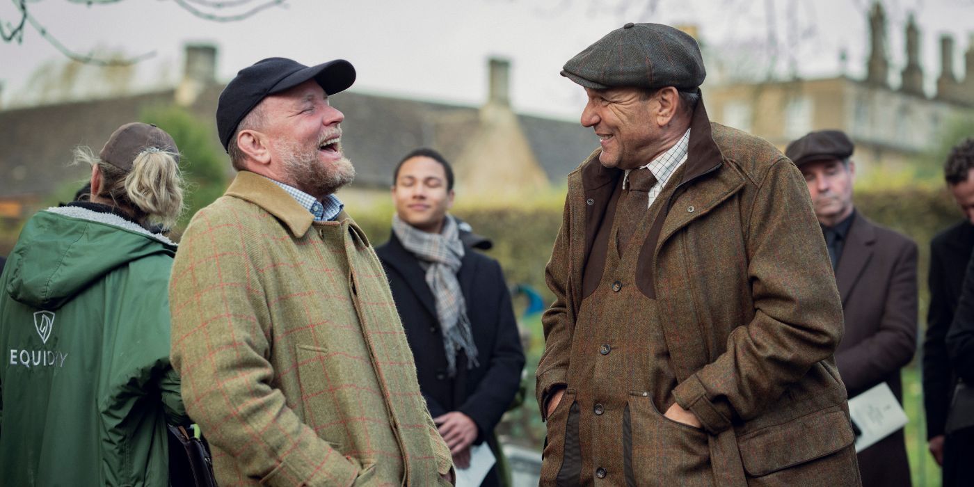 Guy Ritchie and Vinnie Jones, laughing on the set of The Gentlemen