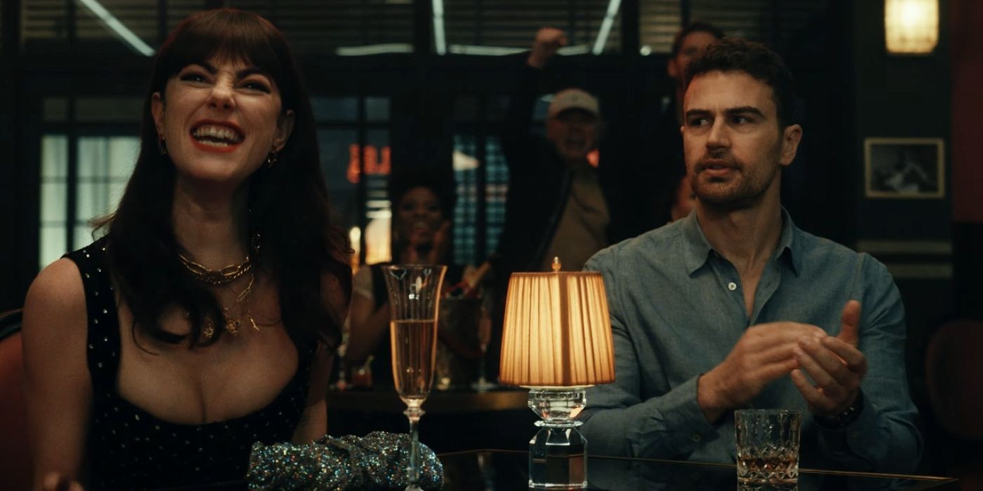 Kaya Scodelario as Susie Glass and Theo James as Eddie Horniman, sitting at a bar, in The Gentlemen