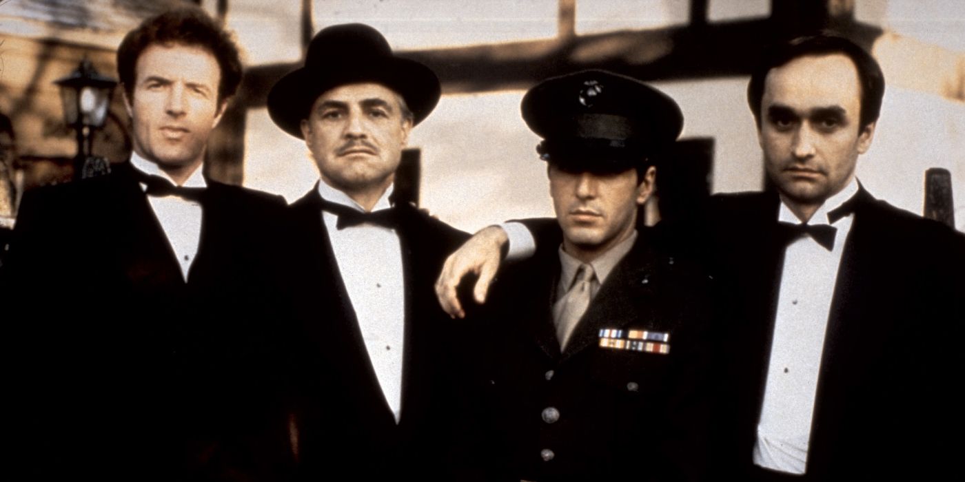 James Caan, Marlon Brando, Al Pacino, and John Cazale in suits in The Godfather