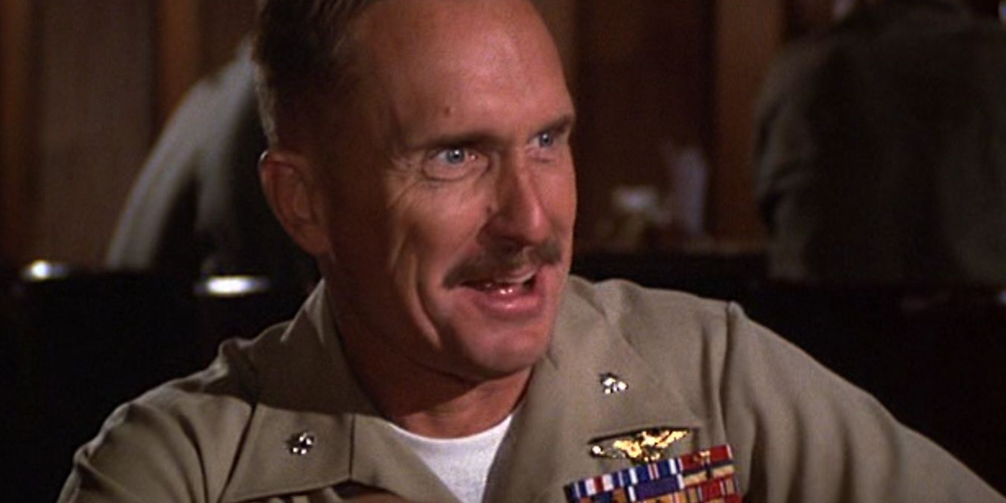 Robert Duvall as Bull Meechum, wearing his uniform and looking shocked in The Great Santini