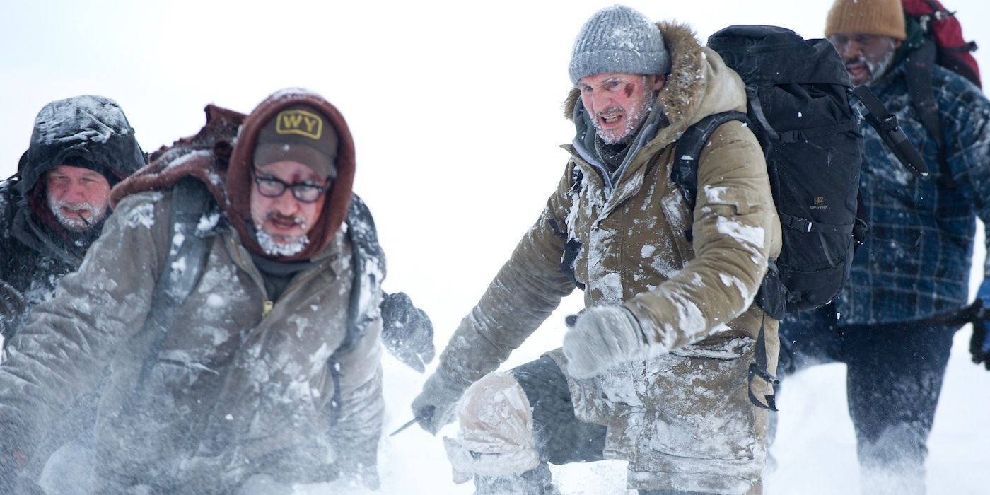 Ottway (Liam Neeson) and his crew hiking through the snow in The Grey