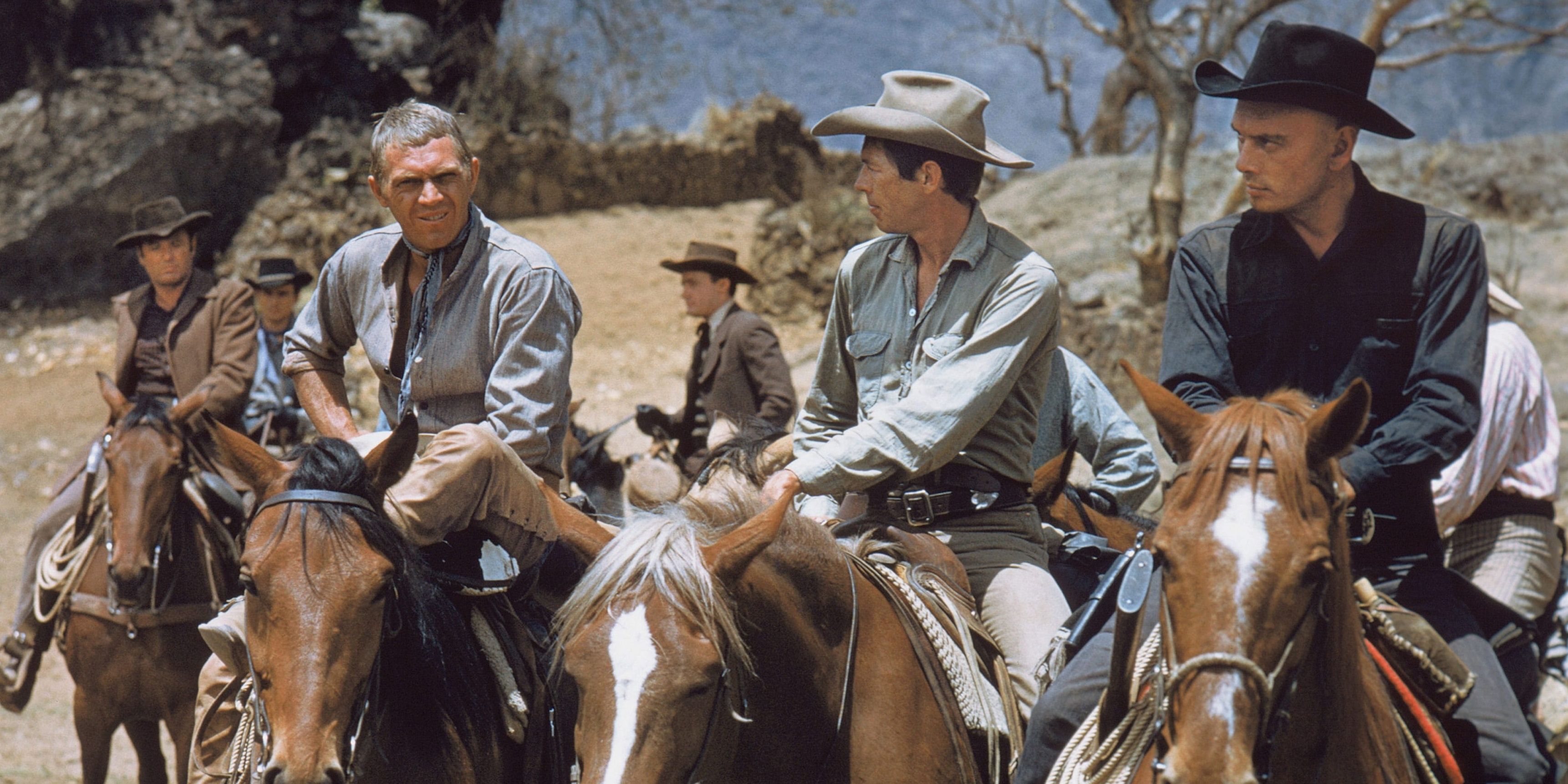 Vin Tanner (Steve McQueen), Chris Larabee Adams (Yul Brunner), and other members of The Magnificent Seven riding on horseback in the 1960 movie