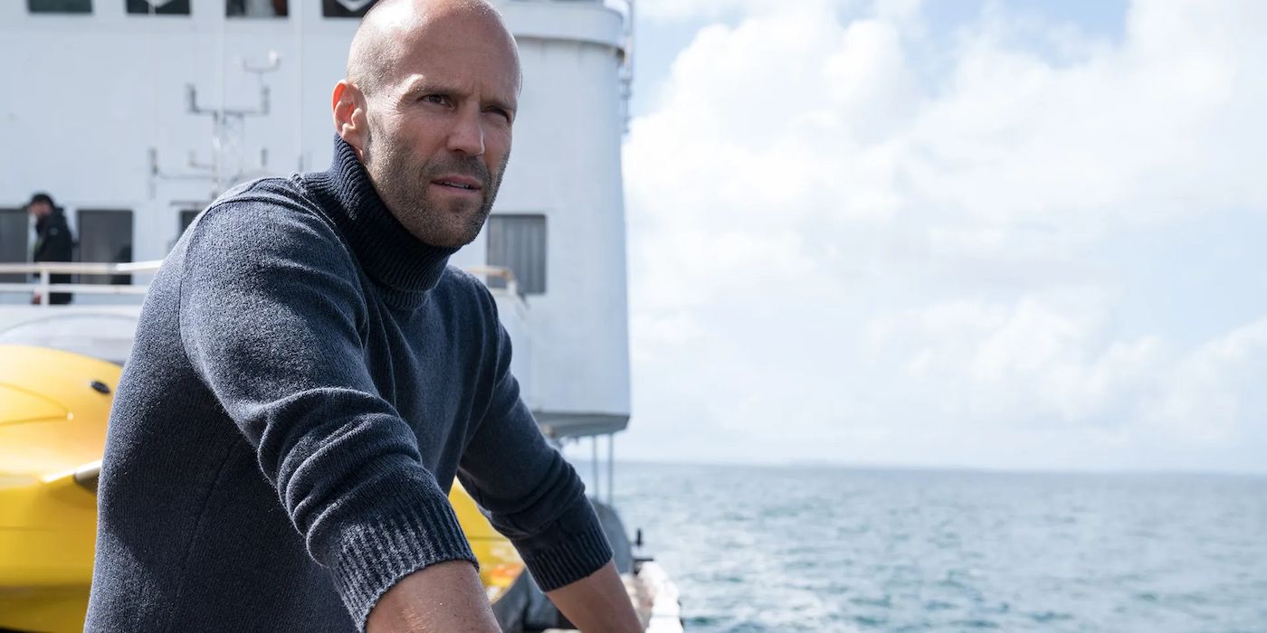 Jonas Taylor looking to the distance from a boat at sea in The Meg