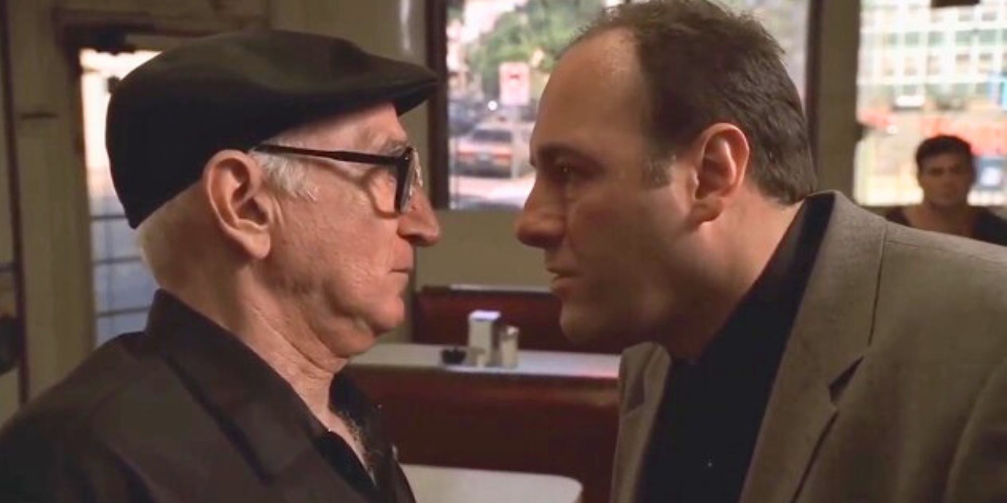 Dominic Chianese and James Gandolfini staring at each other in The Sopranos