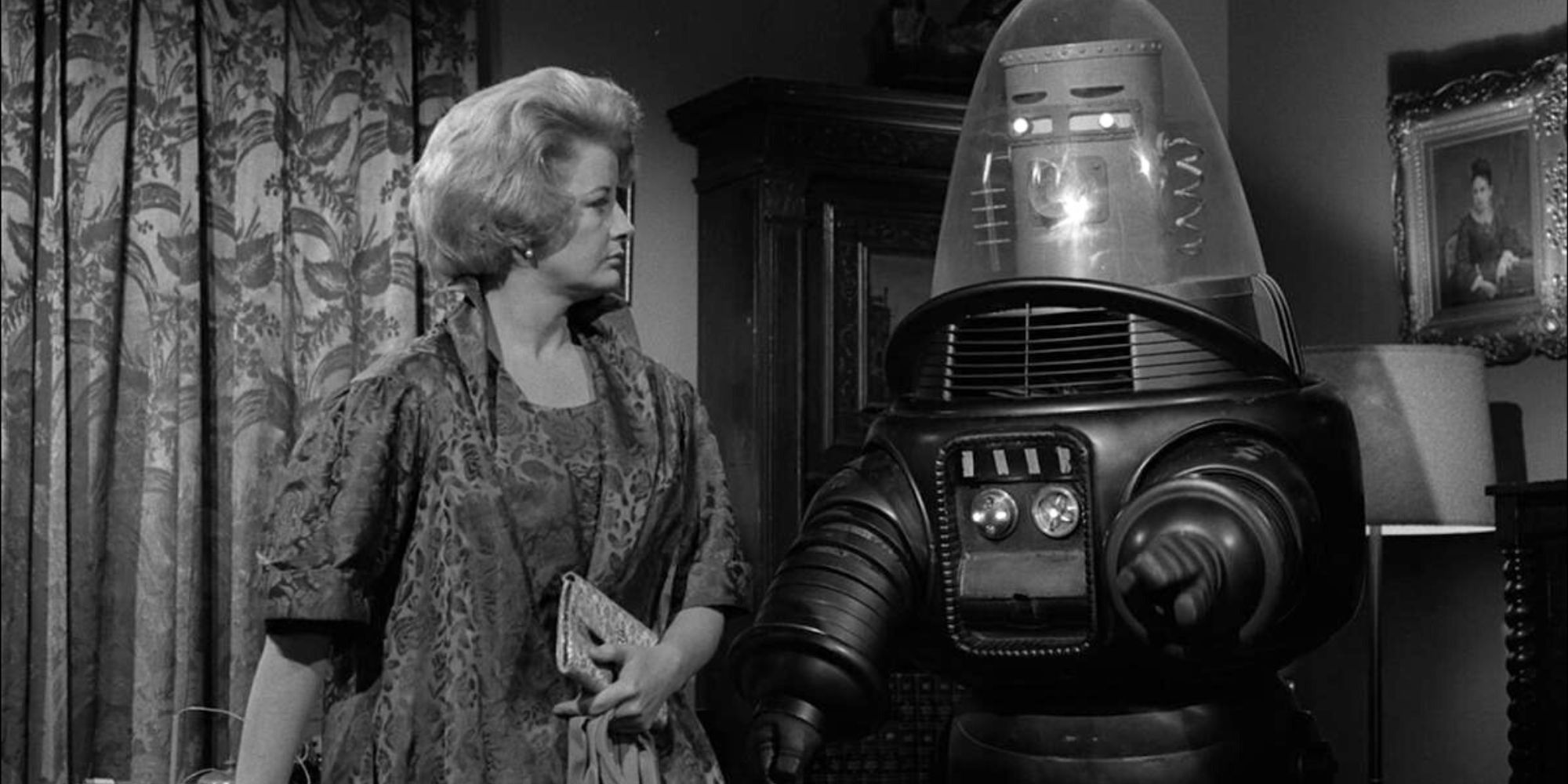 Constance Ford standing next to a giant robot in The Twilight Zone