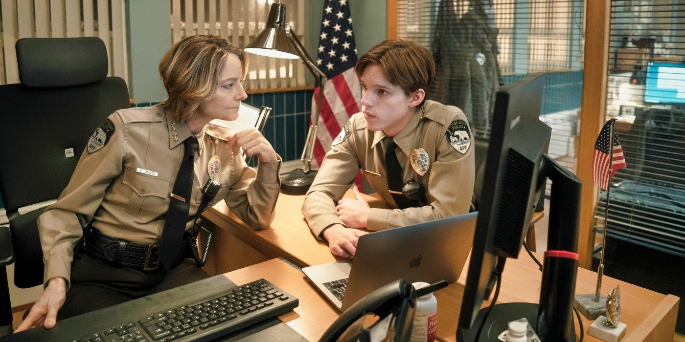 Jodie Foster and Finn Bennett sitting at a desk in True Detective: Night Country