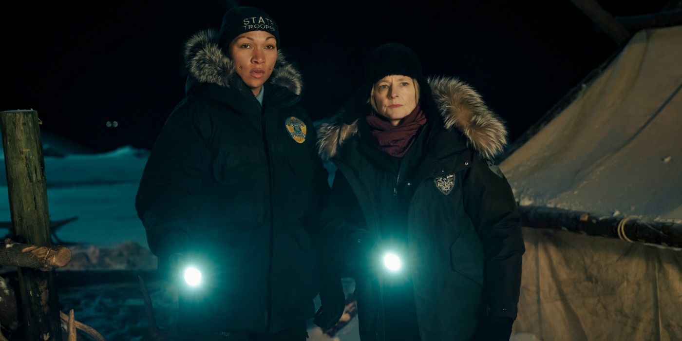 Kali Reis and Jodie Foster standing with flashlights in True Detective: Night Country