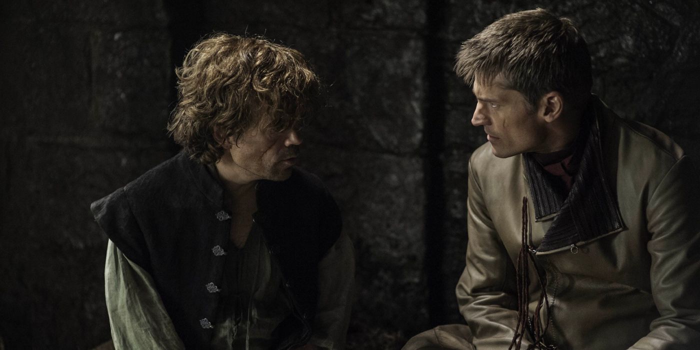 Tyrion Lannister and Jaime Lannister sit together in a dim cell.