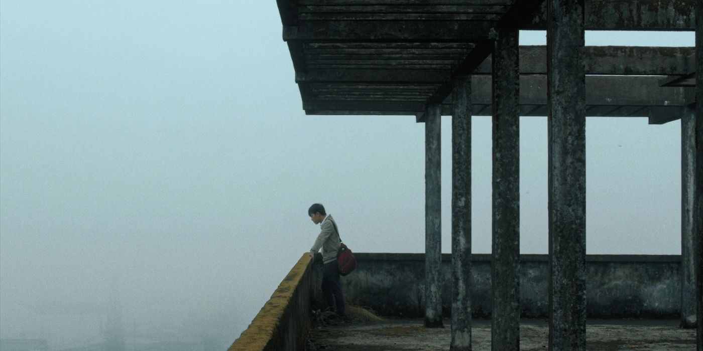 Le Phong Vu as Thien looking out into the fog of Vietnam in Inside the Yellow Cocoon Shell.
