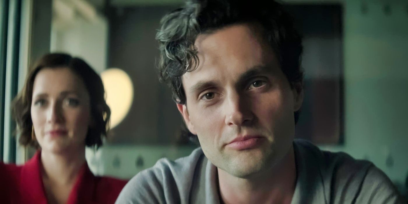 Penn Badgley smiles and sits next to Charlotte Ritchie in the You Season 4 finale