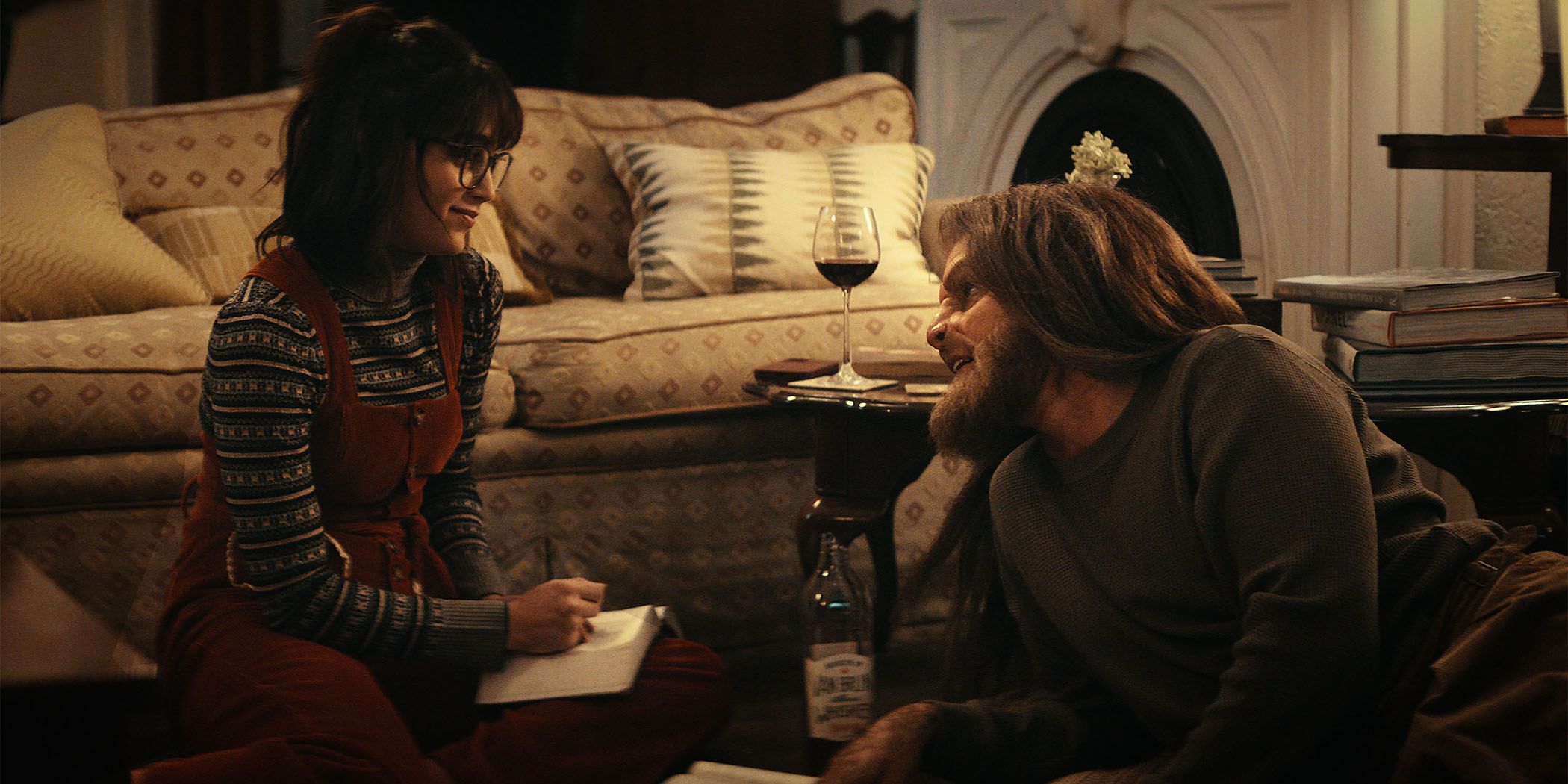 Melissa Barrera and Tommy Dewey have wine on the floor in Your Monster for Sundance 2024.