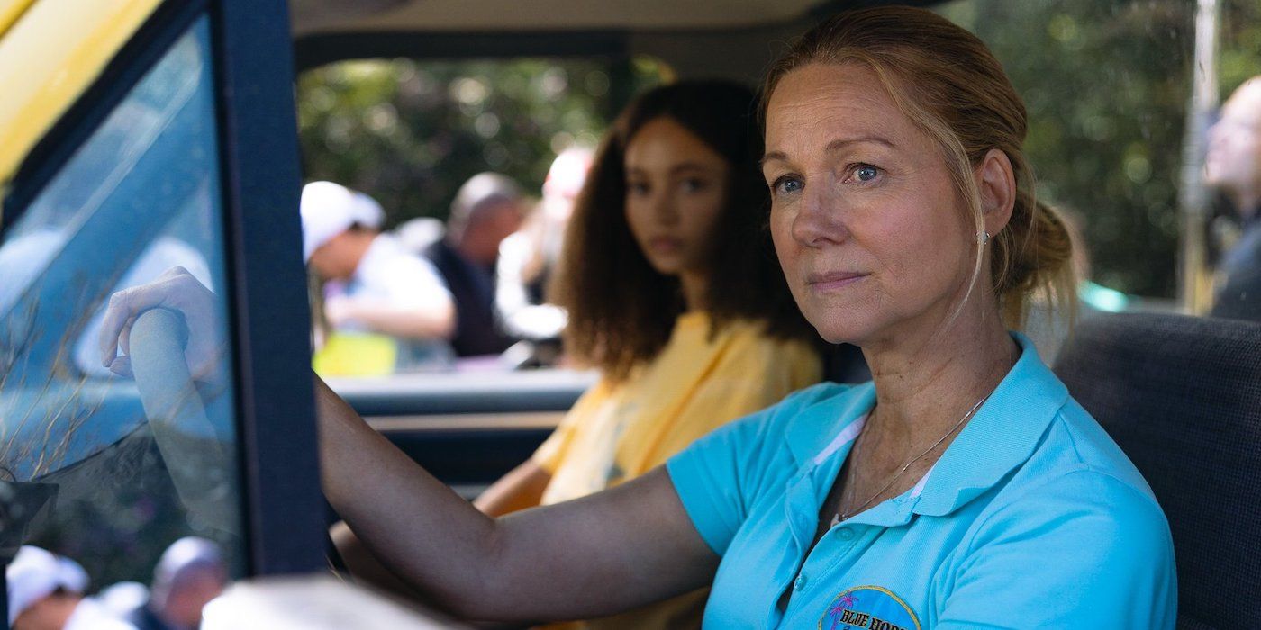 Nico Parker as Doris and Laura Linney as Kristine sitting in a motor vehicle while looking out at something off screen in Suncoast. 