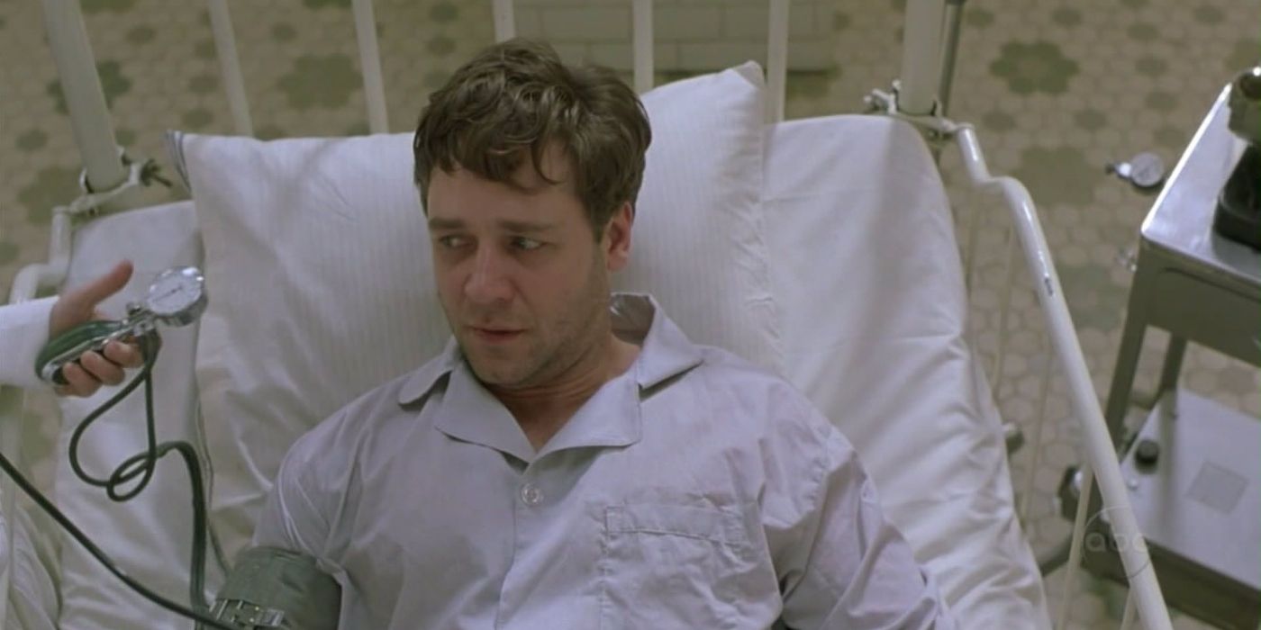 John Nash, looking distressed and lying in a hospital bed in A Beautiful Mind