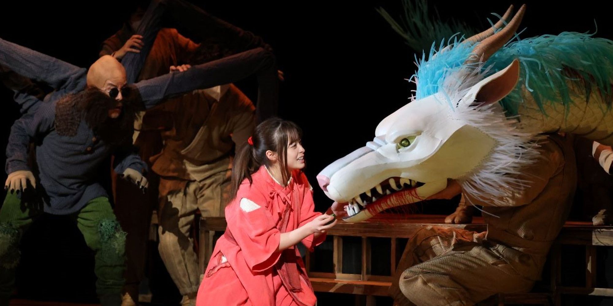 A woman and a dragon in Spirited Away Live on Stage