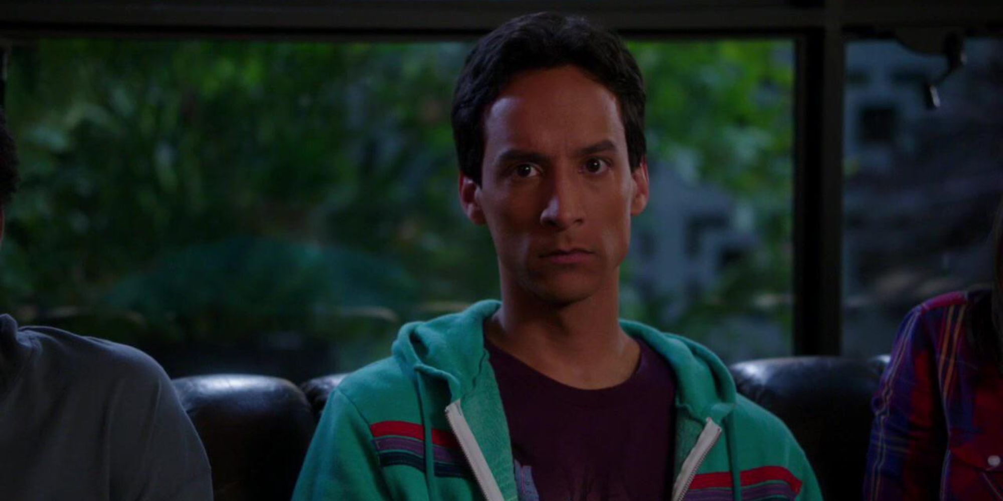 Abed Nadir (Danny Pudi) from Community staring into space, frowning