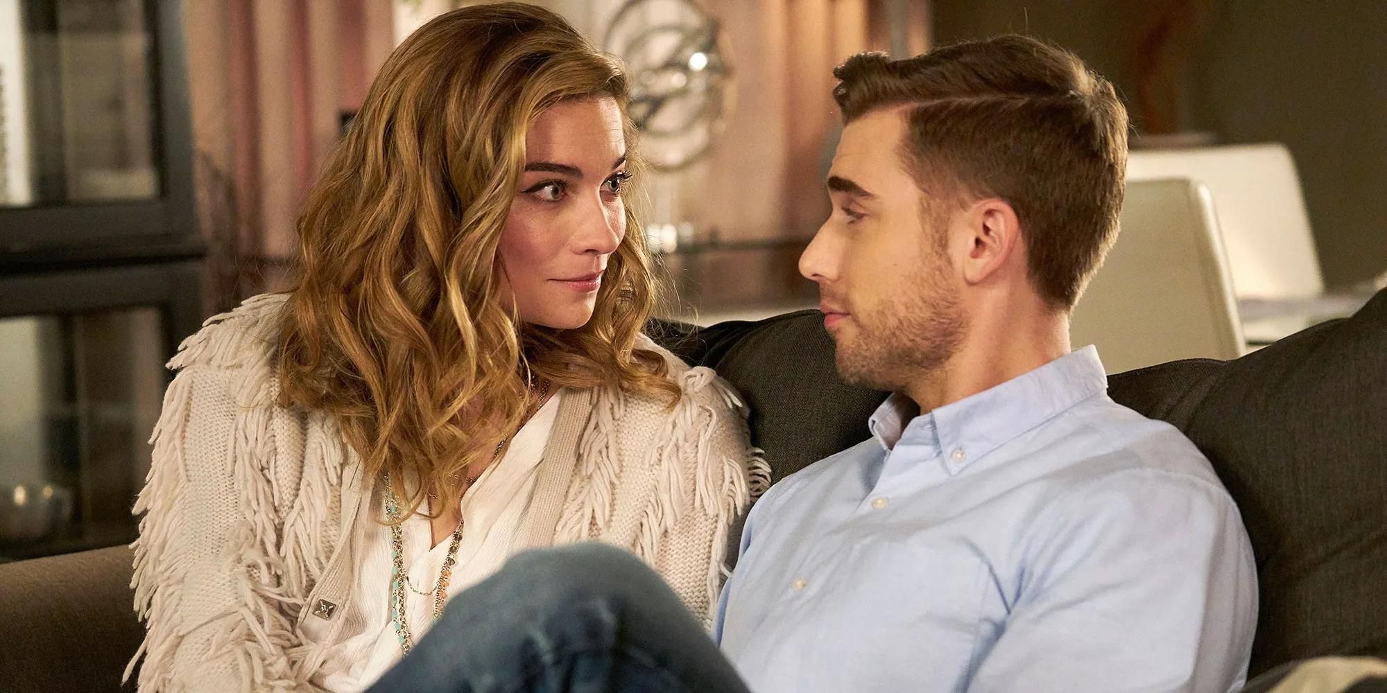 Alexis and Ted from Schitt&rsquo;s Creek sitting together