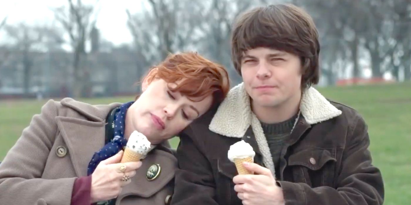 Brendan Meyer as Howie Sheffield eating icecream as Molly Ringwald as Carla Sheffield rests her head on his shoulder in All These Small Moments