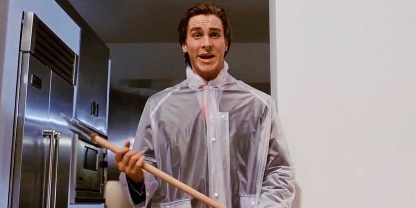 Christian Bale as Patrick Bateman wielding an axe in a fancy apartment in American Psycho