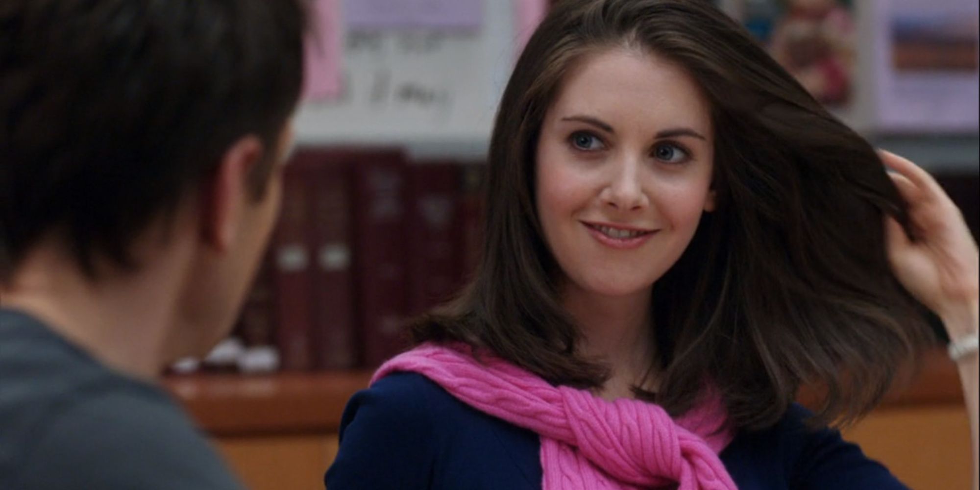 Annie Edison (Alison Brie) from Community flaunting her hair in front of Jeff Winger (Joel McHale)
