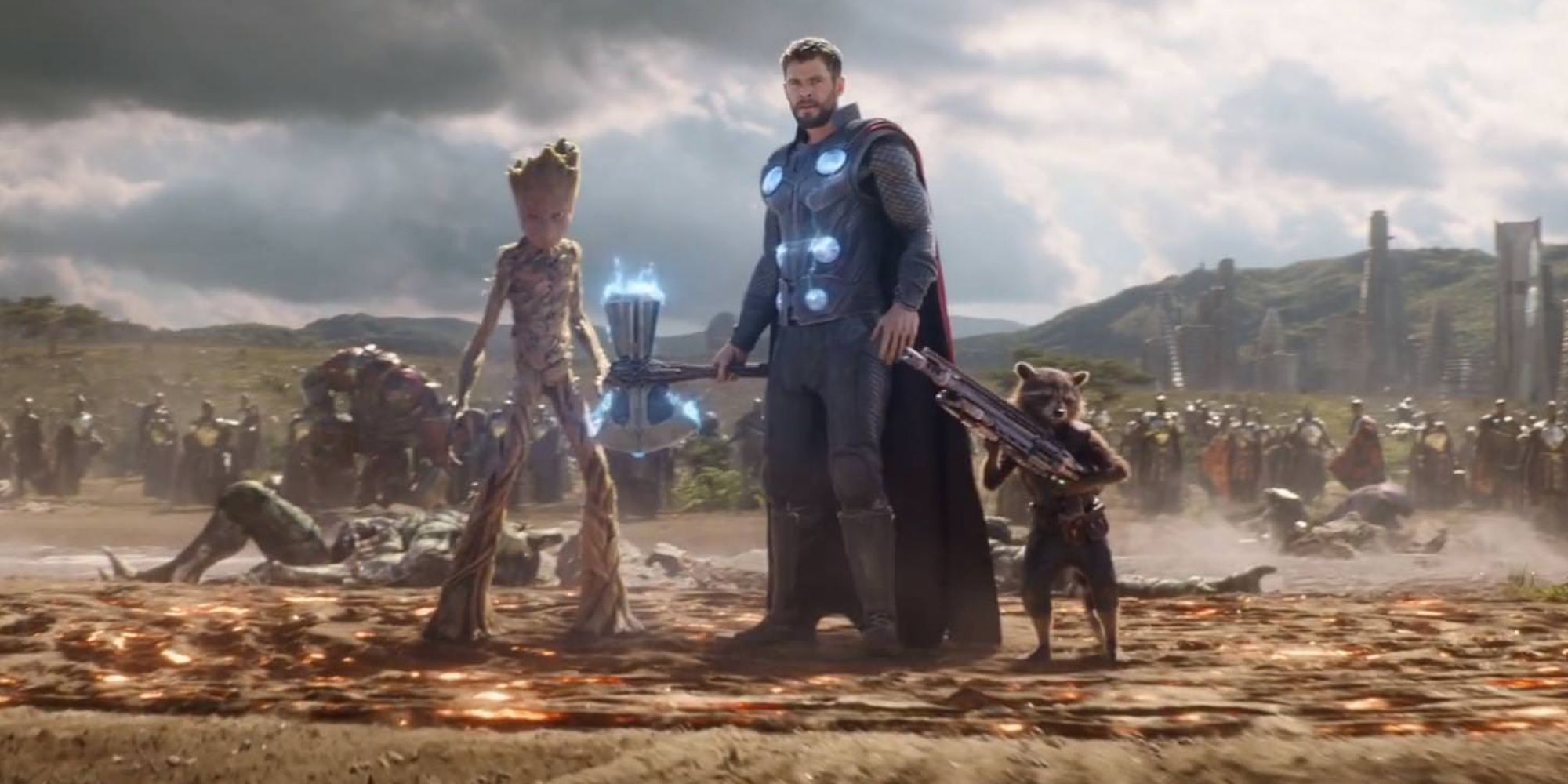 Chris Hemsworth as Thor, holding stormbreaker alongside Groot and Rocket in Avengers: Infinity War