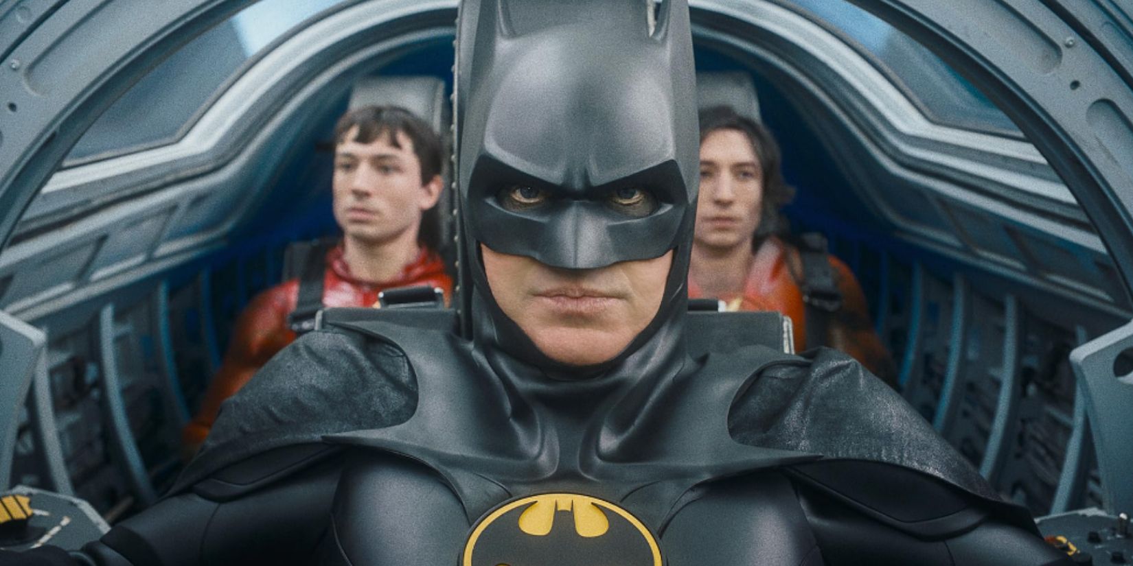 Batman (Michael Keaton) flanked by two versions of Flash (Ezra Miller) in the Batwing from The Flash