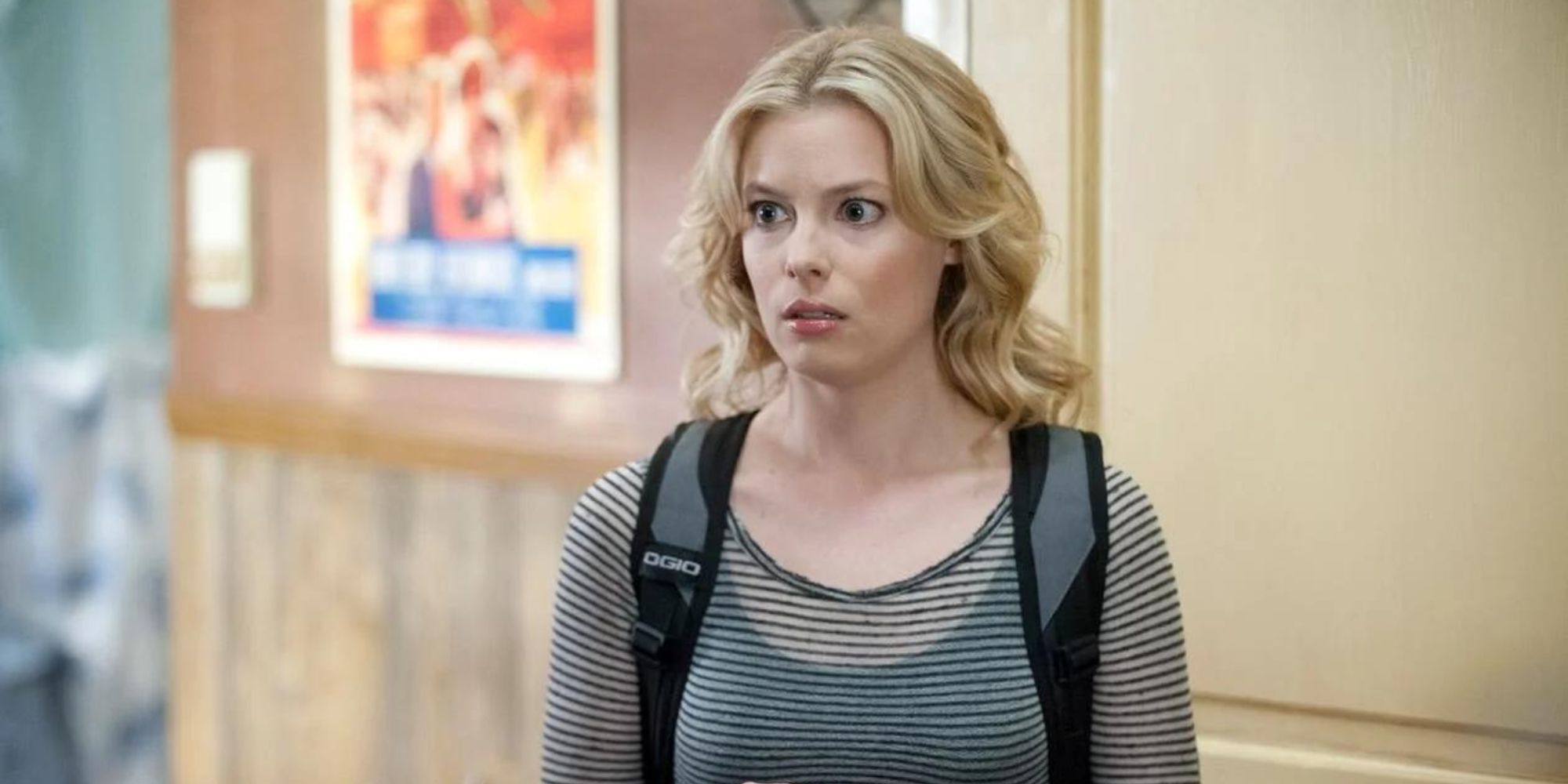 Britta Perry (Gillian Jacobs) from Community, standing and frowning