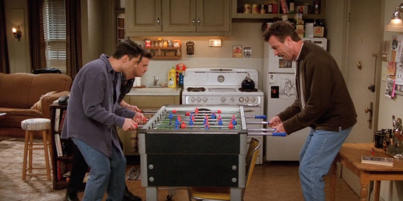 Matt LeBlanc, Matthew Perry, and Tom Selleck around the foosball table on Friends. 