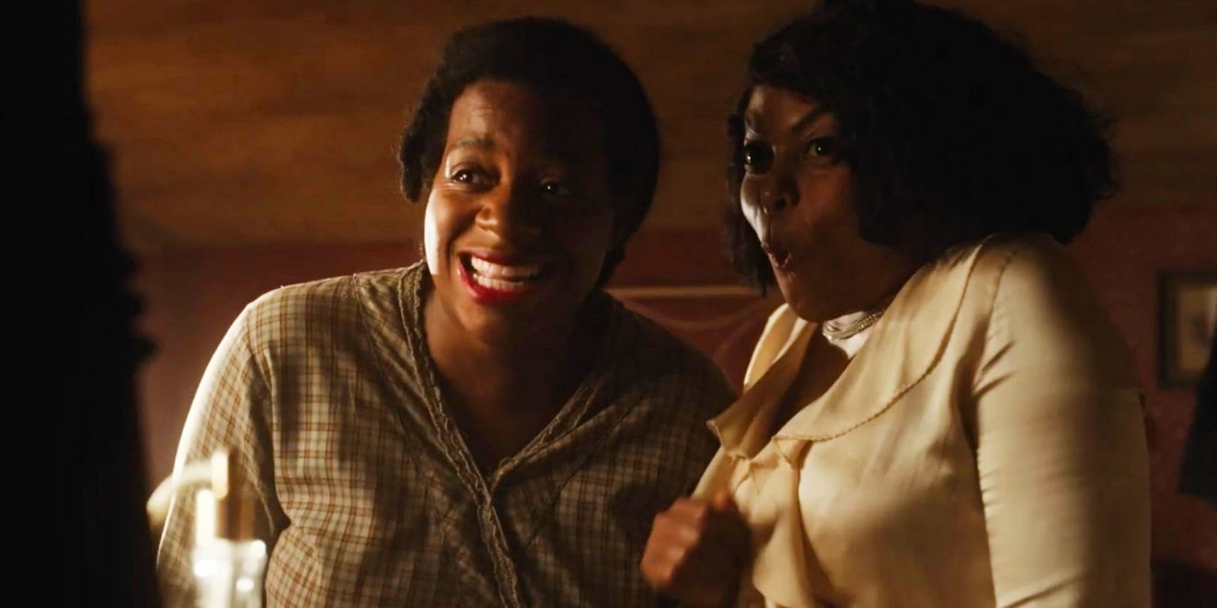 Celie (Fantasia Barrino) and Shug Avery (Taraji P. Henson) excited together in The Color Purple