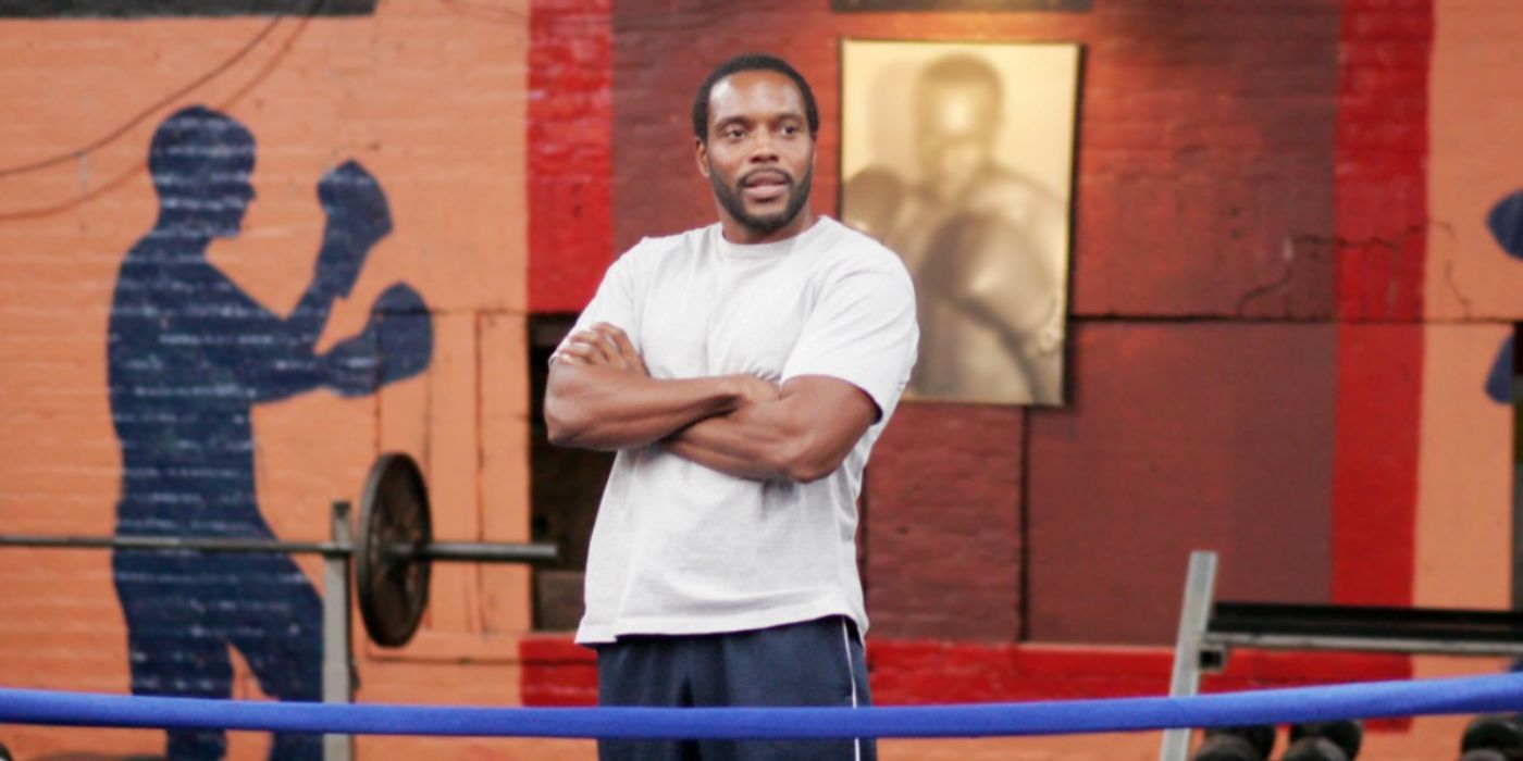 Chad L. Coleman as Cutty, standing with his arms crossed in the boxing ring in The Wire