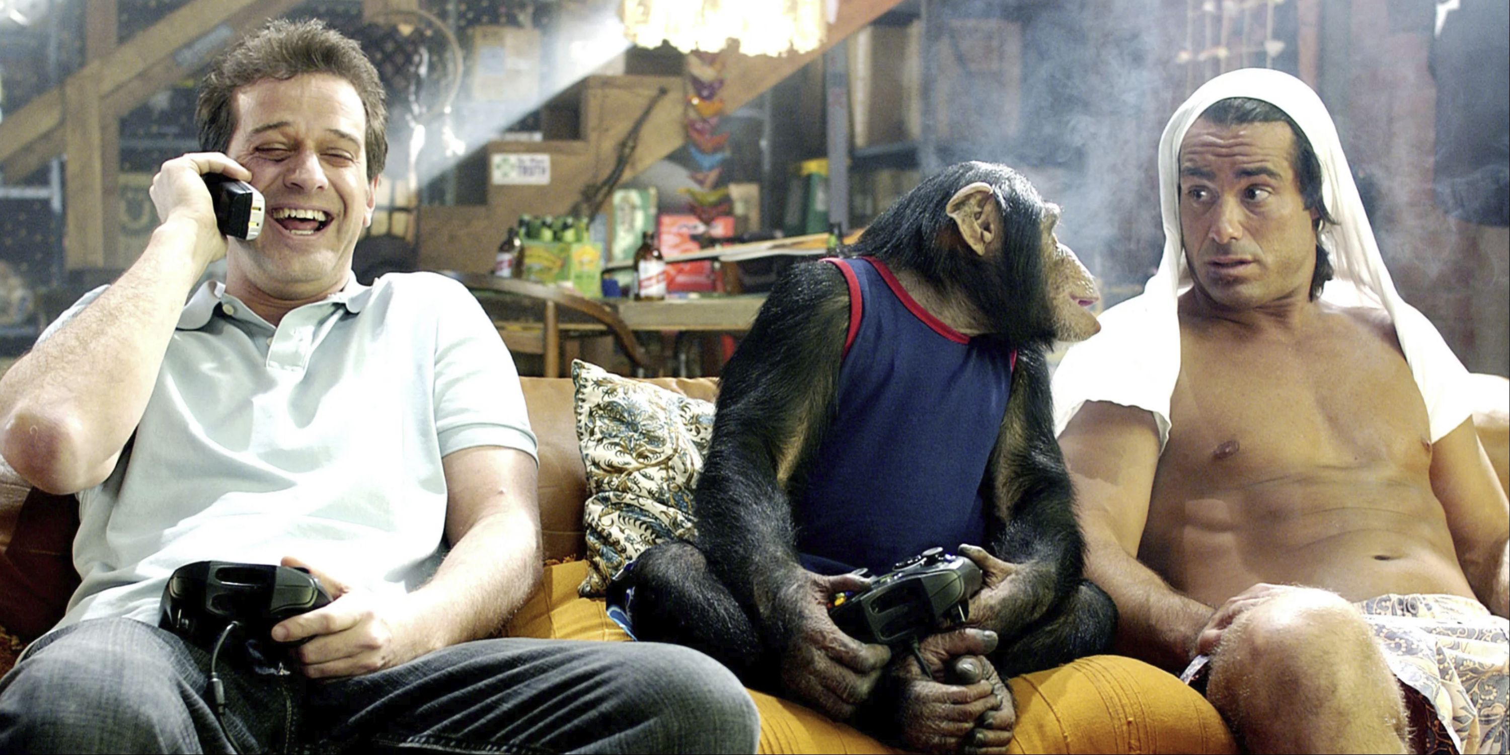 Allen Covert as Alex and Peter Dante as Dante sit on a couch with a monkey in Grandma's Boy