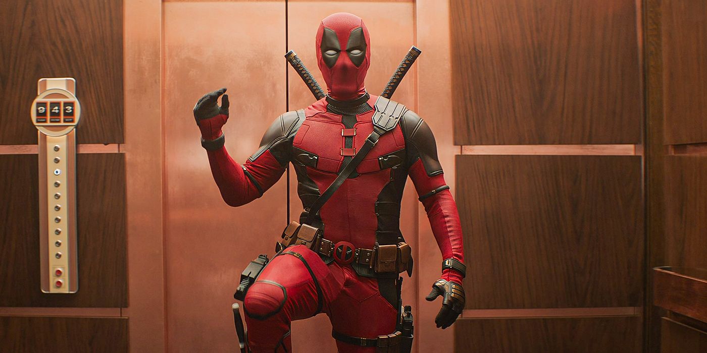 Deadpool half-waving to the camera in front of an elevator, in Deadpool & Wolverine