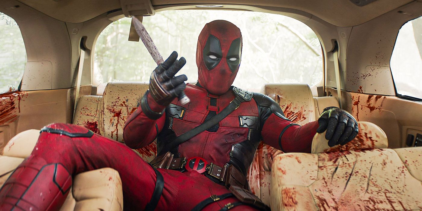 Ryan Reynolds as Deadpool covered in blood in a car in Marvel's Deadpool & Wolverine