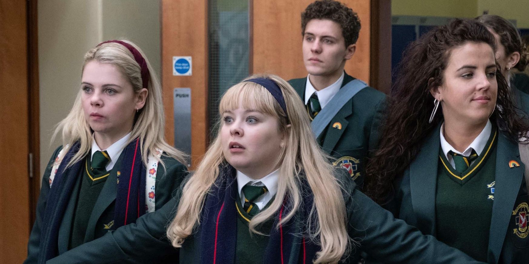 Nicola Coughlan as Clare Devlin stands in front of her friends on Derry Girls