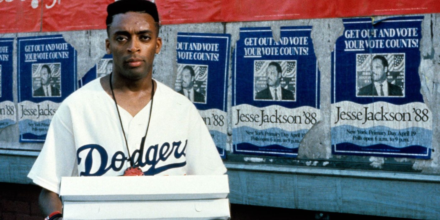 Spike Lee as Mookie holding boxes in Do the Right Thing