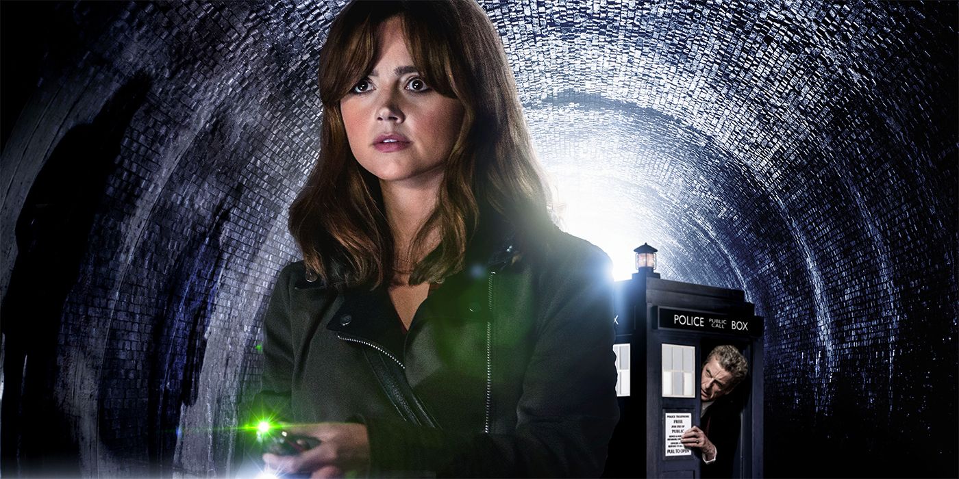 Jenna Coleman as Clara Oswald holding the sonic screwdriver with Peter Capaldi as the Doctor stuck in the Tardis in Doctor Who
