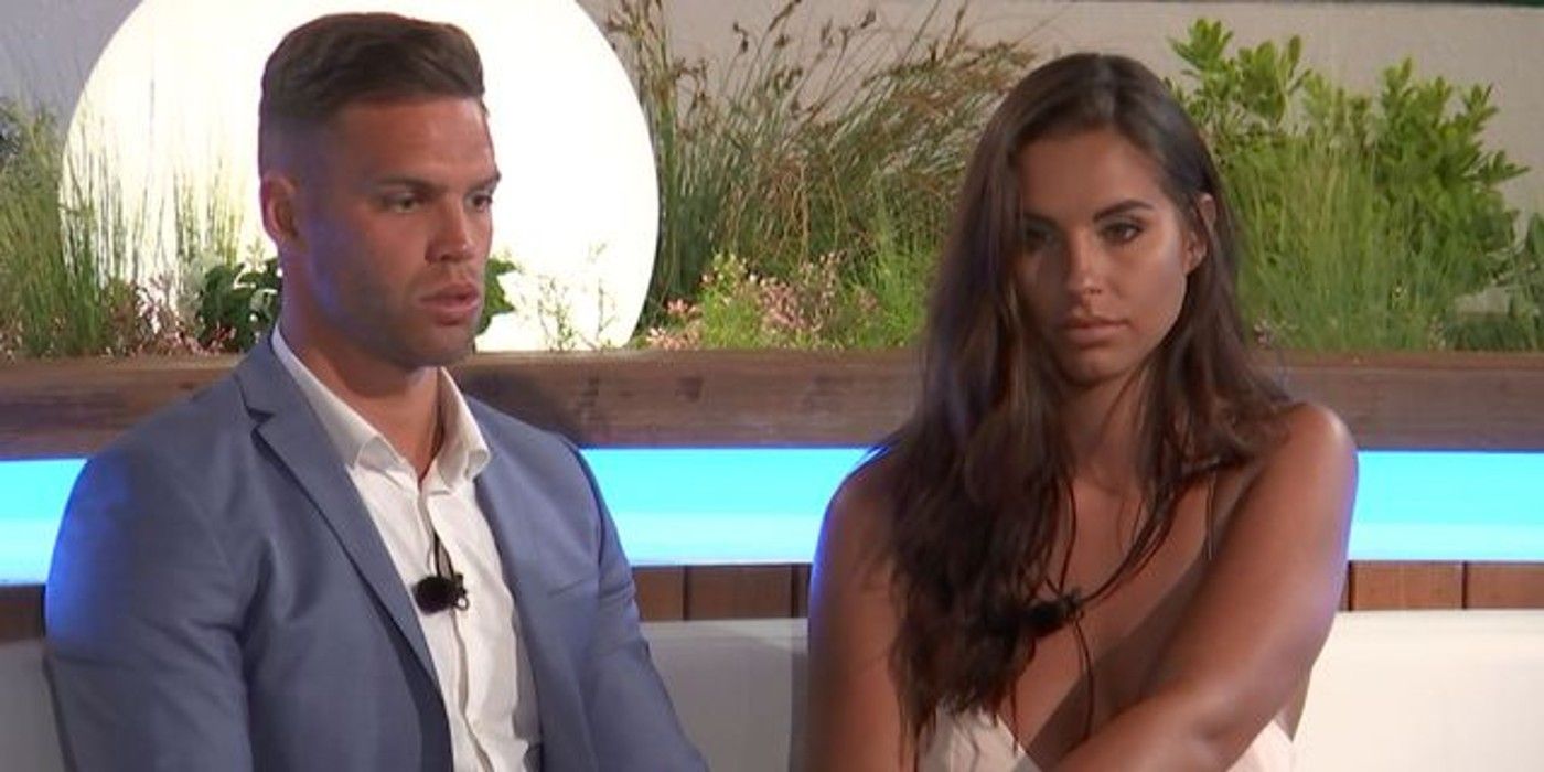 Dom & Jess sit at the bonfire, worried about the results, in Love Island UK