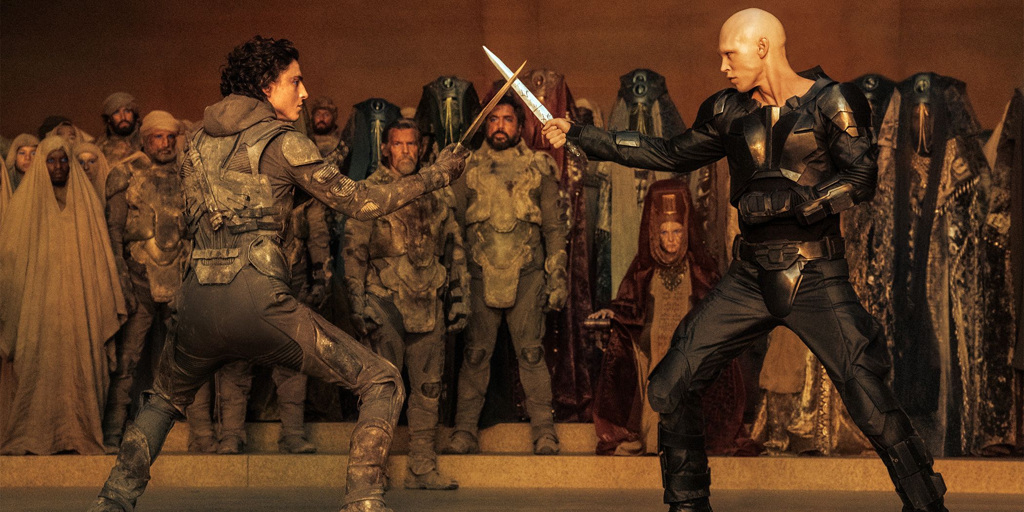 Timothee Chalamet as Paul Atriedes and Austin Butler as Feyd-Rautha sword fighting in Dune: Part Two
