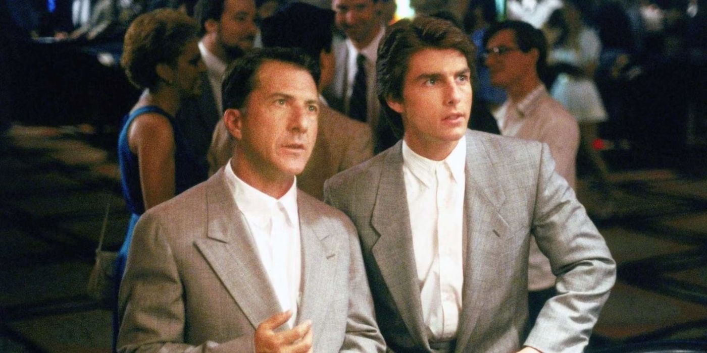 Raymond and Charlie Babbitt in matching suits looking ahead in Rain Man