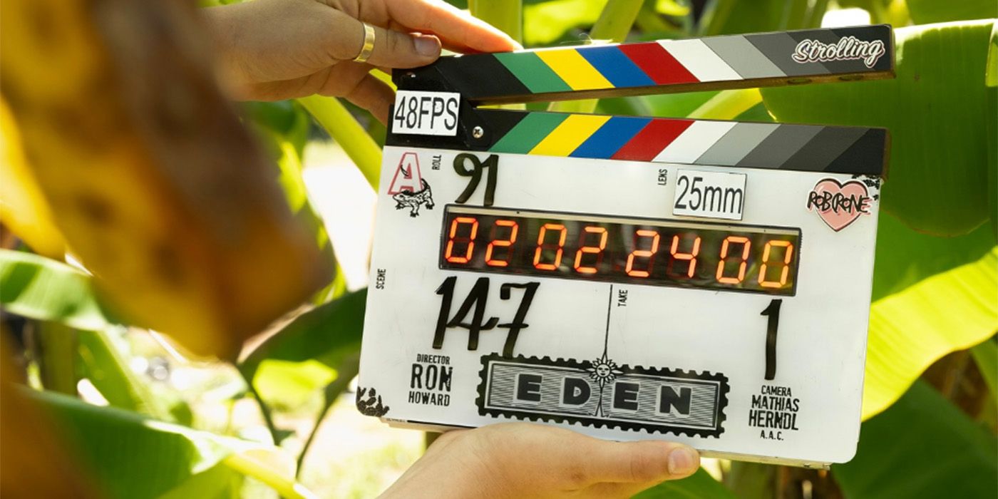 The clapper from Eden being held by Ron Howard in front of plants