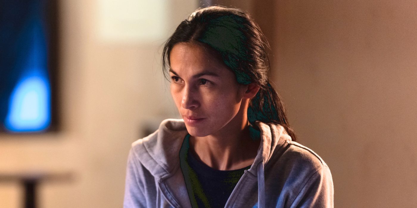 Elodie Yung as Thony wearing a gray hoodie in The Cleaning Lady Season 3.