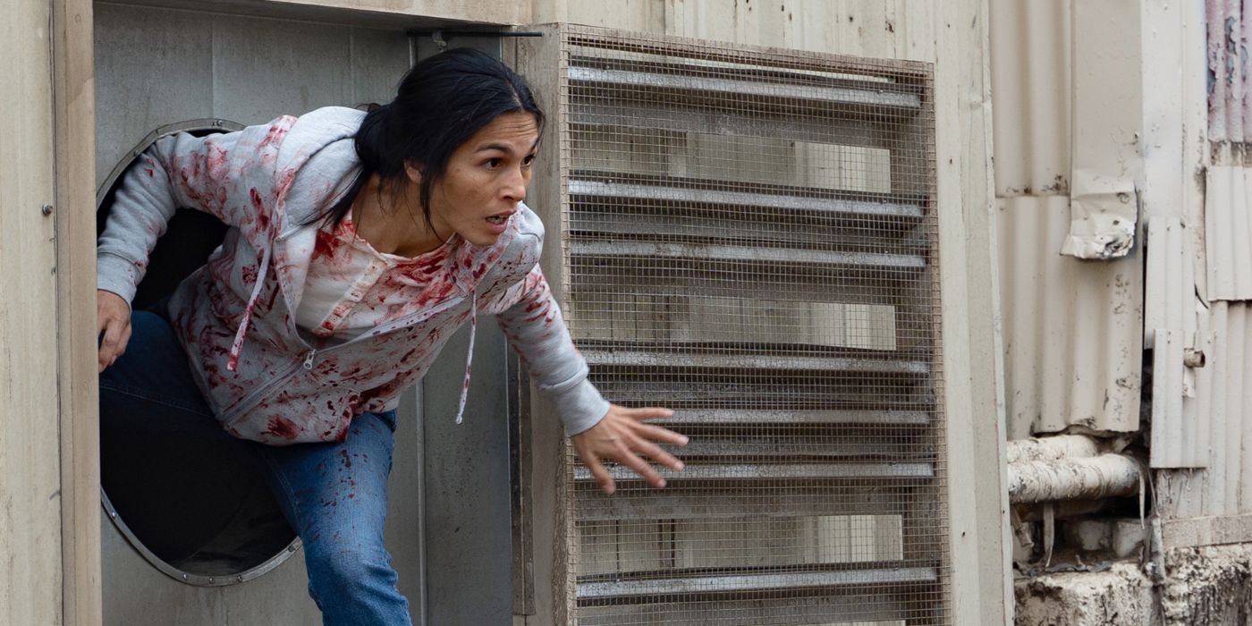 Elodie Yung as Thony, escaping through a vent, in The Cleaning Lady Season 3.