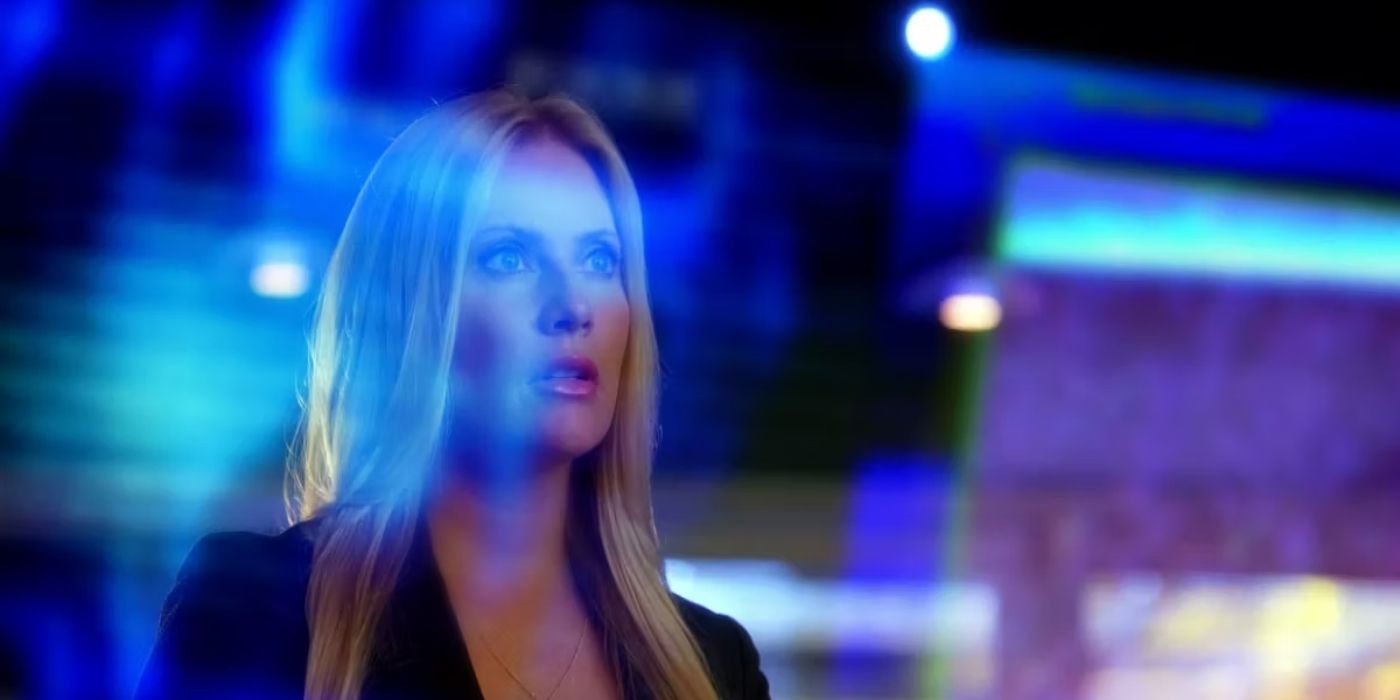 Emily Procter staring at a blue screen in CSI Miami