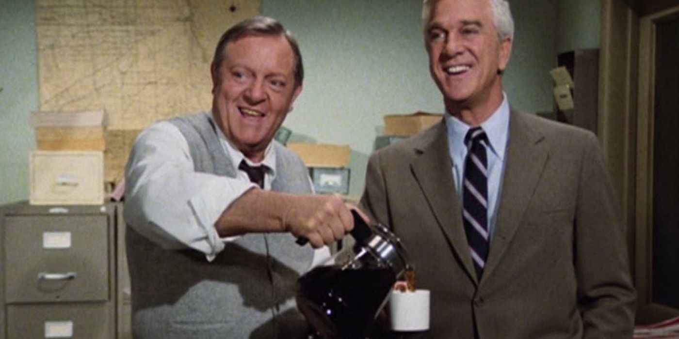 Ed Hocken (Alan North) pours Frank Drebin (Leslie Nielsen) a never-ending cup of coffee in 'Police Squad!'