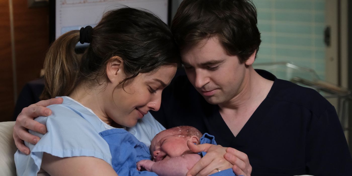 Freddie Highmore and Paige Spara as Shawn and Lea holding their newborn baby in 'The Good Doctor' Season 6