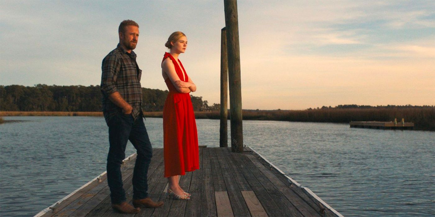 Ben Foster and Elle Fanning standing on a dock in Galveston