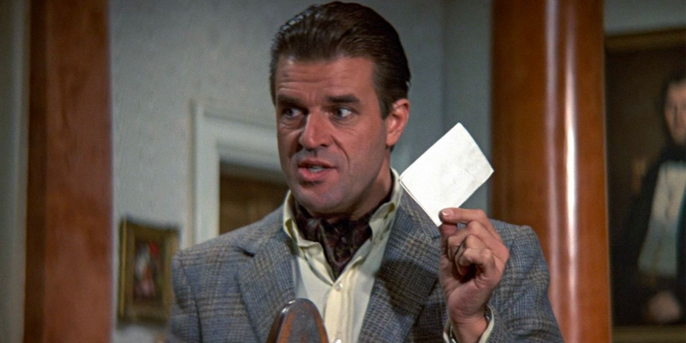 General Georgi Koskov, played by Jeroen Krabbé, holds up a folded note as he speaks in 'The Living Daylights'.