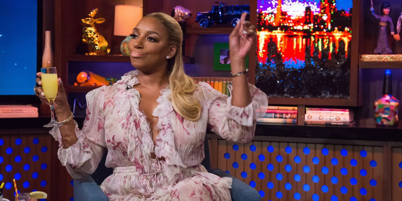 Nene Leakes attends Watch What Happens Live with drink in hand